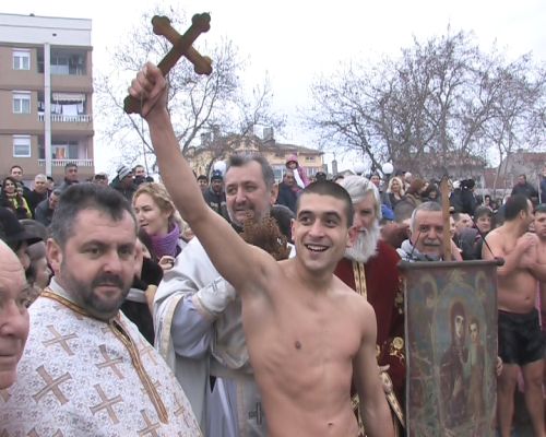 A person who pulled out the cross on Theophany Bulgarian tradition