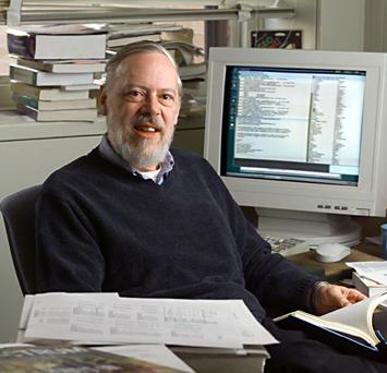 Dennis Ritche near a personal computer picture