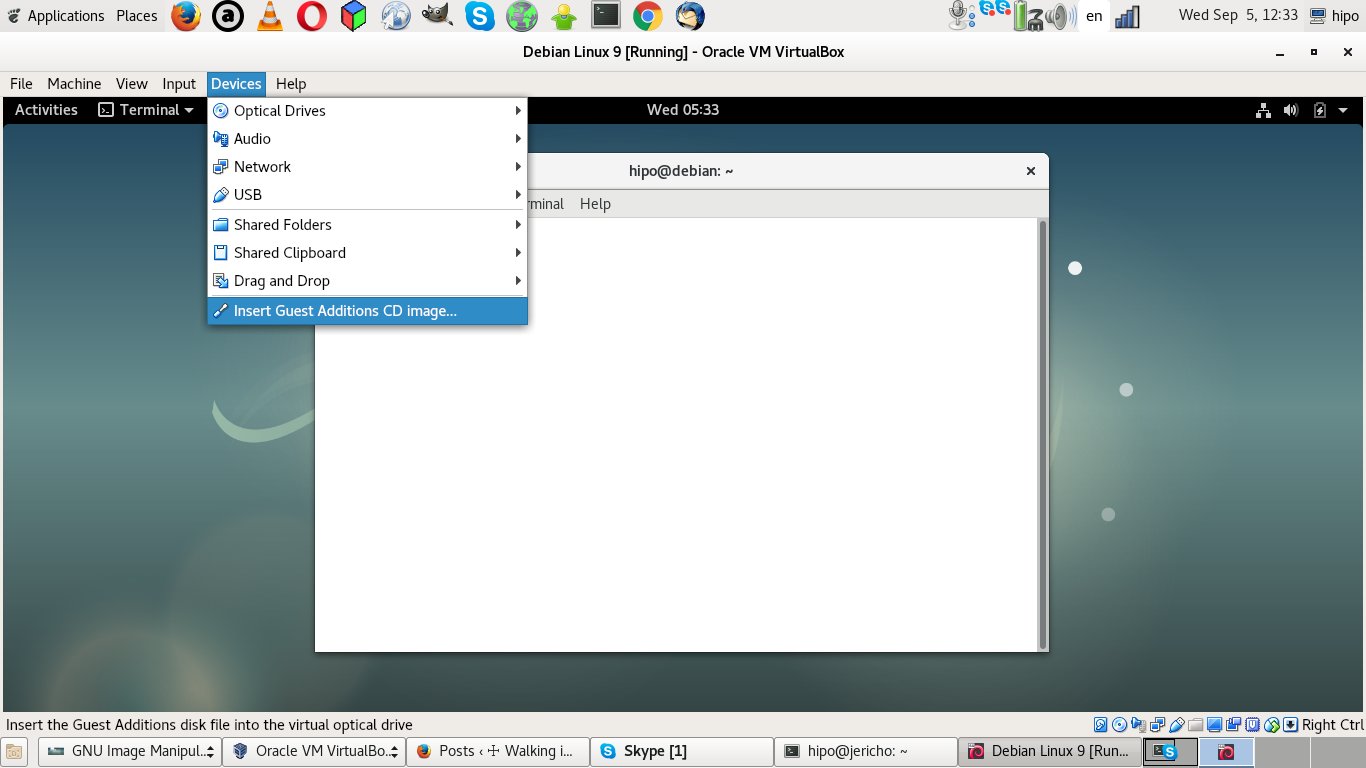 virtualbox-VM-enable-insert-guest-additions-CD-image-menu-screenshot-debian-linux